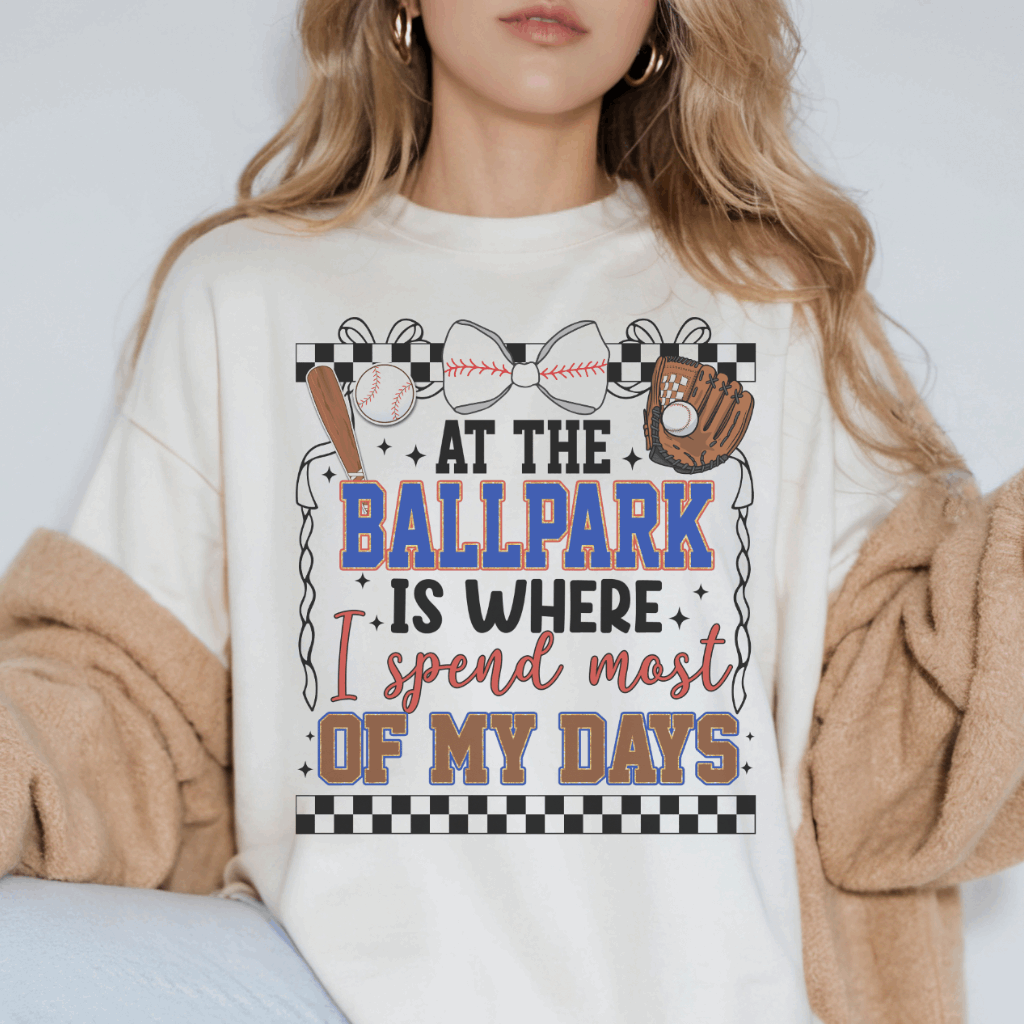At The Ballpark Is Where I Spend Most Of My Days Comfort Colors Tee – Vintage-inspired baseball graphic t-shirt for women. Soft, garment-dyed fabric offers a relaxed fit, perfect for game days, baseball moms, or casual wear. Available in various colors and sizes. Shop stylish baseball tees at Melody Faye.