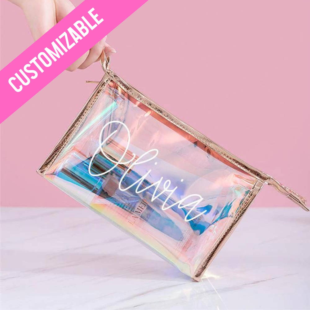 A clear makeup bag with a gold zipper, designed for bridesmaids. This stylish and functional bag can be personalized with a name or monogram, making it a perfect gift for members of the bridal party. The transparent design allows for easy viewing of contents, and the bag is ideal for storing cosmetics and other small essentials.