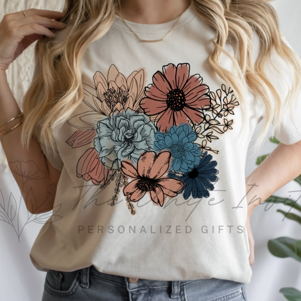 A women's graphic t-shirt with short sleeves, featuring a beautiful "Boho Floral" design. This soft and comfortable Bella Canvas short sleeve tee is perfect for adding a touch of bohemian elegance to your wardrobe. 