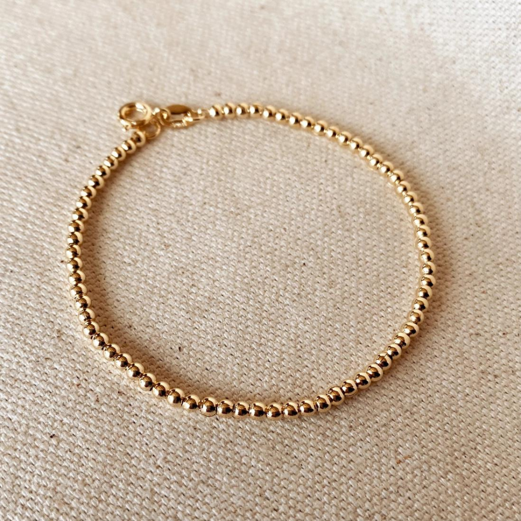 Add a touch of sophistication with our 18k Gold Filled 2.5mm Beaded Bracelet, featuring finely crafted beads for a timeless and elegant design. Perfect for any occasion, this versatile piece complements any outfit effortlessly.