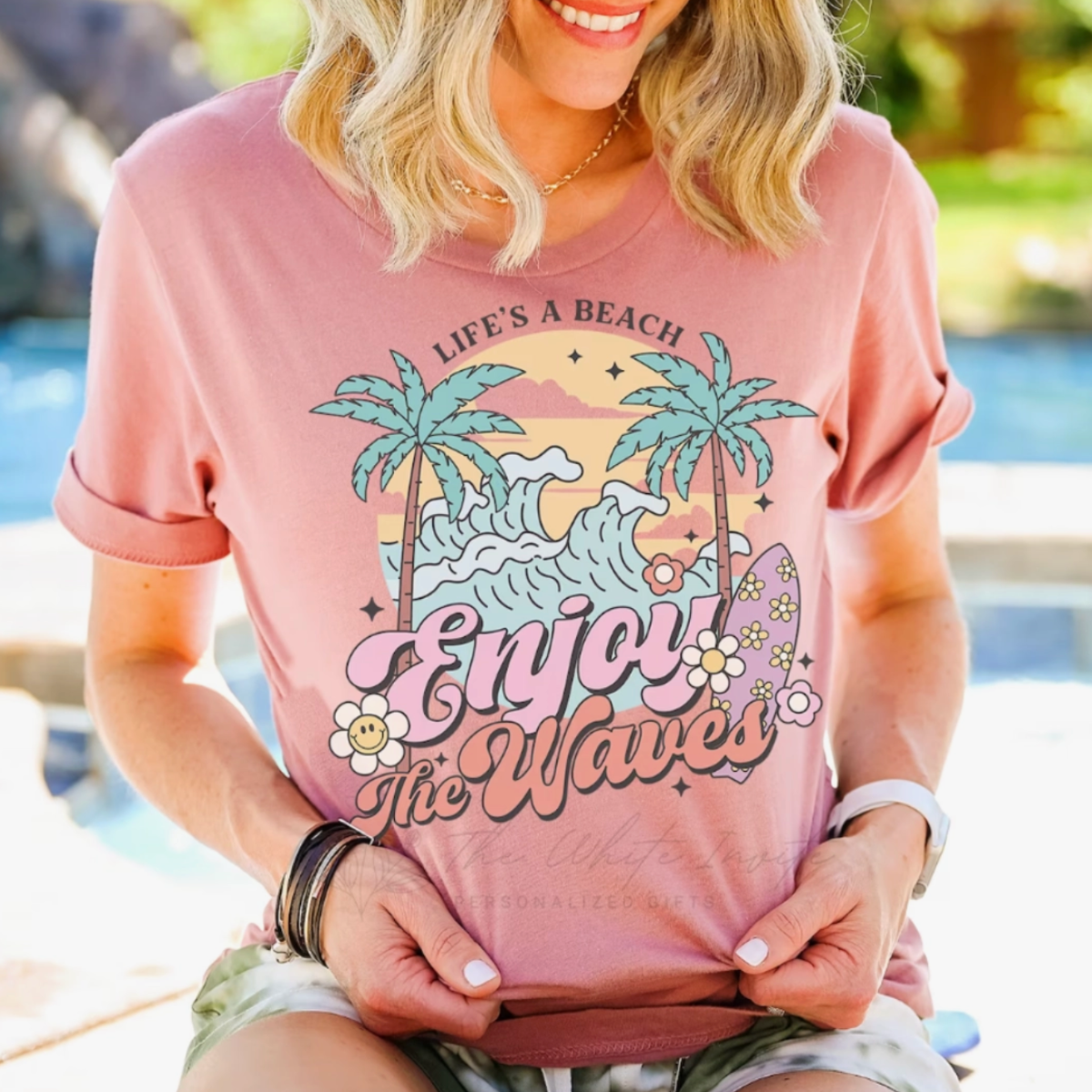 Enjoy the Waves Summer Retro Style Women&#39;s Graphic Tee, fun and vibrant t-shirt with a &#39;Enjoy the Waves&#39; graphic, perfect for beach days and summer vibes, made from soft, breathable cotton for ultimate comfort, available at Melody Faye.