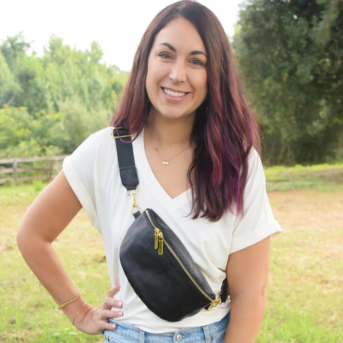 A women's black leather fanny pack crossbody bag, crafted from high-quality pebble leather. This versatile, water-resistant, and lightweight bag can be worn as a crossbody or belt bag and features an adjustable strap. Its compact yet spacious design measures 9.4”x5.9”x3.5”, ideal for daily use or travel. The bag is customizable with optional personalization, adding initials for a unique touch.