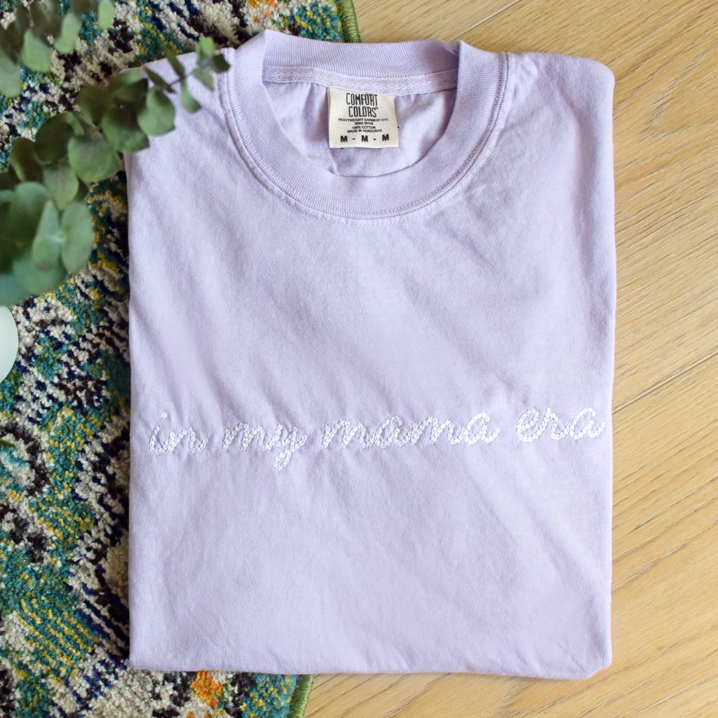 Embroidered &#39;In My Mama Era&#39; Comfort Colors Tee, stylish and sentimental t-shirt with delicate embroidery, perfect for moms embracing every moment, made from soft, durable cotton for everyday comfort, available at Melody Faye.