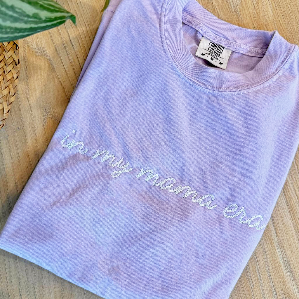 Embroidered 'In My Mama Era' Comfort Colors Tee, stylish and sentimental t-shirt with delicate embroidery, perfect for moms embracing every moment, made from soft, durable cotton for everyday comfort, available at Melody Faye.