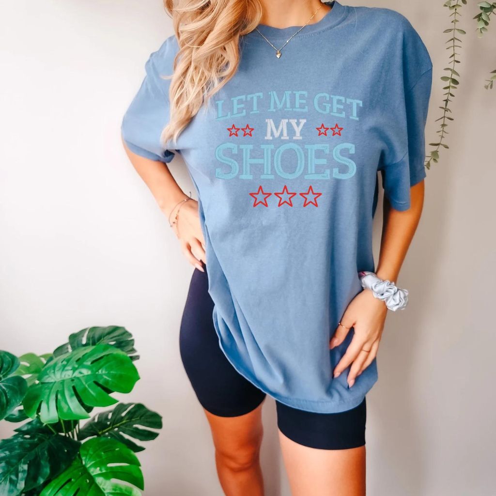 Add humor to your wardrobe with our Embroidered Let Me Get My Shoes Trump Graphic T-Shirts for Women. Made from soft Comfort Colors cotton, these short sleeve tops offer comfort and a good laugh. Perfect as a gift, each graphic tee is sure to bring a smile.