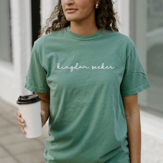 Kingdom Seeker embroidered Christian Comfort Colors Tee with minimalist faith-inspired text, stitched on soft vintage-washed unisex t-shirt