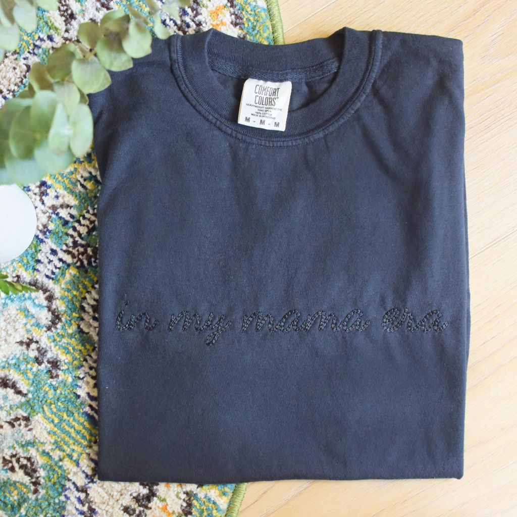 Embroidered 'In My Mama Era' Comfort Colors Tee, stylish and sentimental t-shirt with delicate embroidery, perfect for moms embracing every moment, made from soft, durable cotton for everyday comfort, available at Melody Faye.