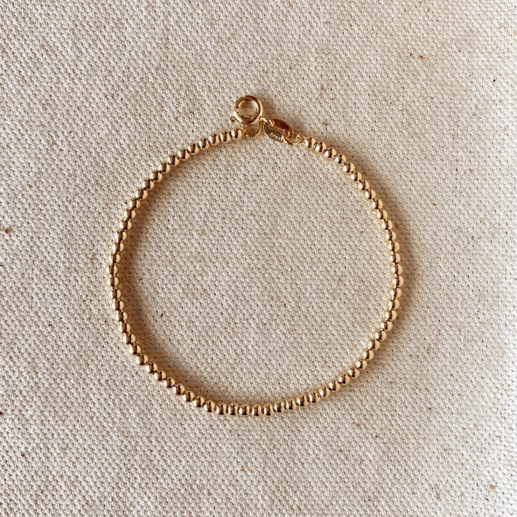 Add a touch of sophistication with our 18k Gold Filled 2.5mm Beaded Bracelet, featuring finely crafted beads for a timeless and elegant design. Perfect for any occasion, this versatile piece complements any outfit effortlessly.