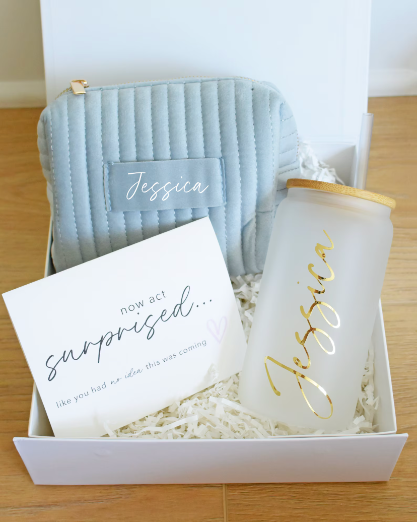 A Bridesmaid Proposal Box with a magnetic lid, personalized glass tumbler, jewelry box, and proposal card.