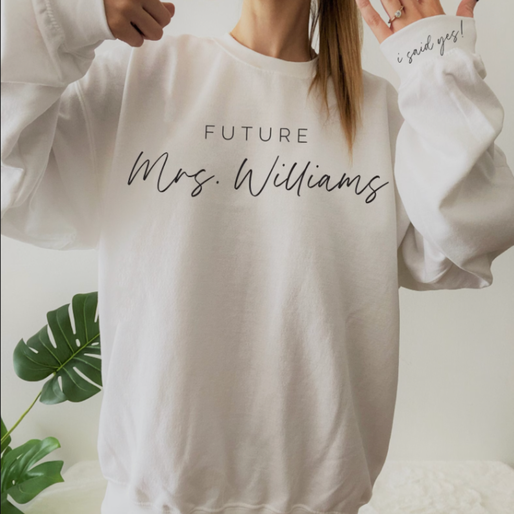 Future Mrs. Sweatshirt, 'I Said Yes' sleeve graphic design, perfect for newly engaged brides-to-be, cozy and stylish crewneck sweatshirt for celebrating your special moment, available at Melody Faye.