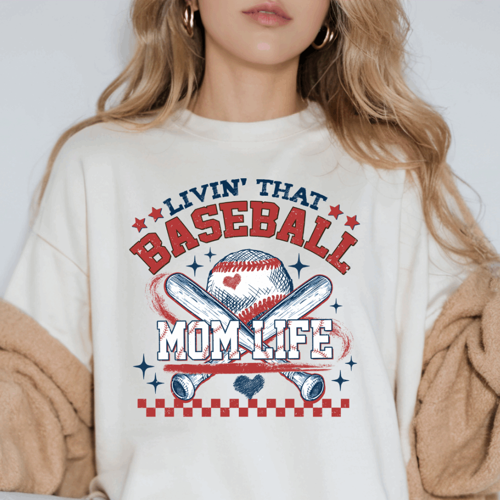 Livin&#39; That Baseball Mom Life Comfort Colors Tee – Vintage-inspired t-shirt celebrating baseball moms. Soft, garment-dyed fabric offers a relaxed fit, perfect for game days, team spirit, or everyday wear. Available in various colors and sizes.