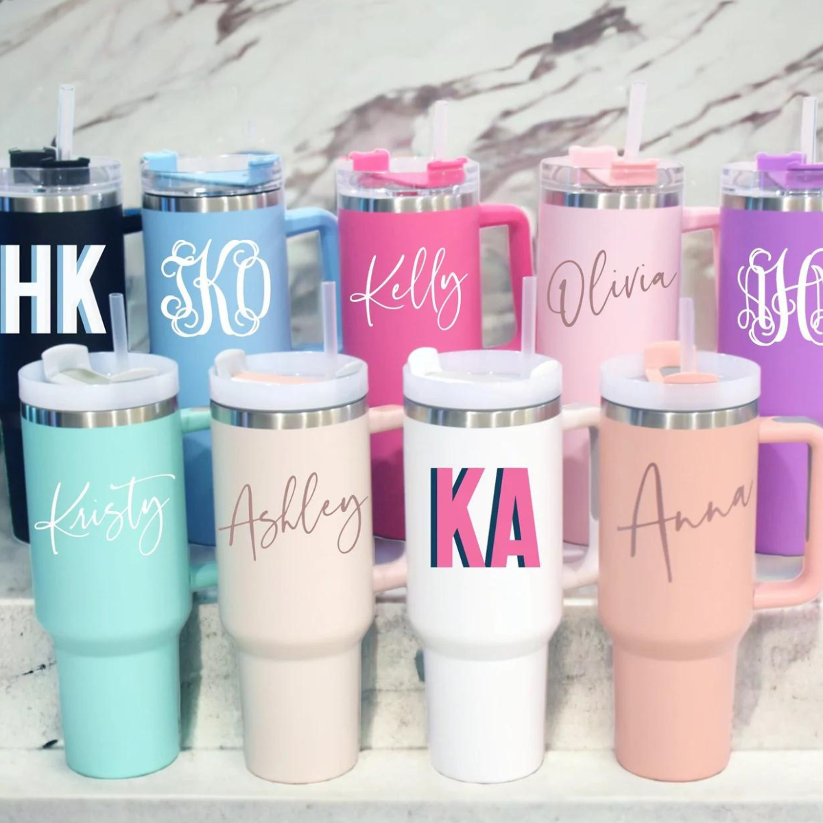 40 oz Tumbler with Handle, personalized with a name or design, and includes a straw. This large, durable tumbler is perfect for keeping drinks at the ideal temperature, featuring a convenient handle and customizable exterior.