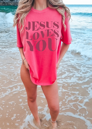 Faith-based graphic t-shirt with large Jesus Loves You typography