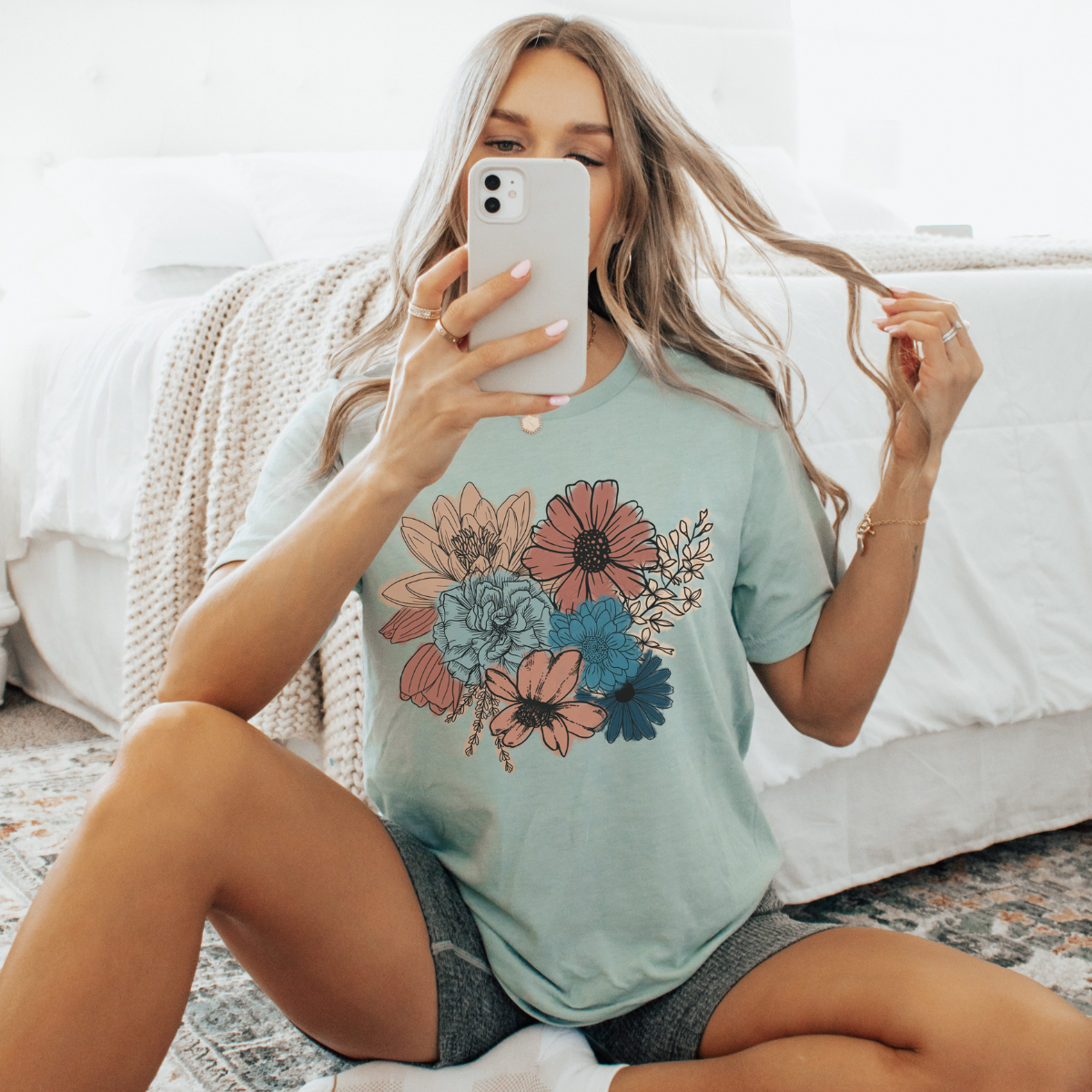 A women&#39;s graphic t-shirt with short sleeves, featuring a beautiful &quot;Boho Floral&quot; design. This soft and comfortable Bella Canvas short sleeve tee is perfect for adding a touch of bohemian elegance to your wardrobe. 