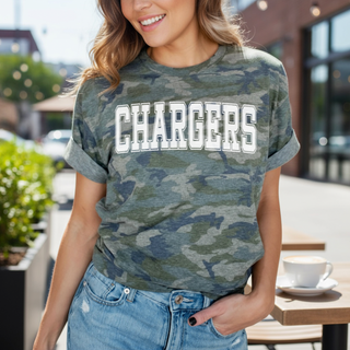Person wearing a camouflage 'CHARGERS' t-shirt outdoors.