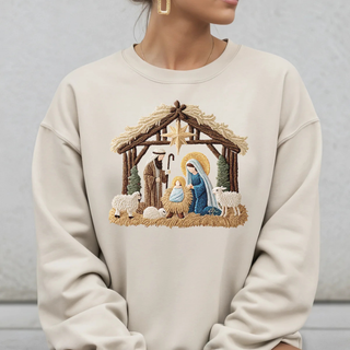 Beige sweatshirt with nativity scene design worn by a person