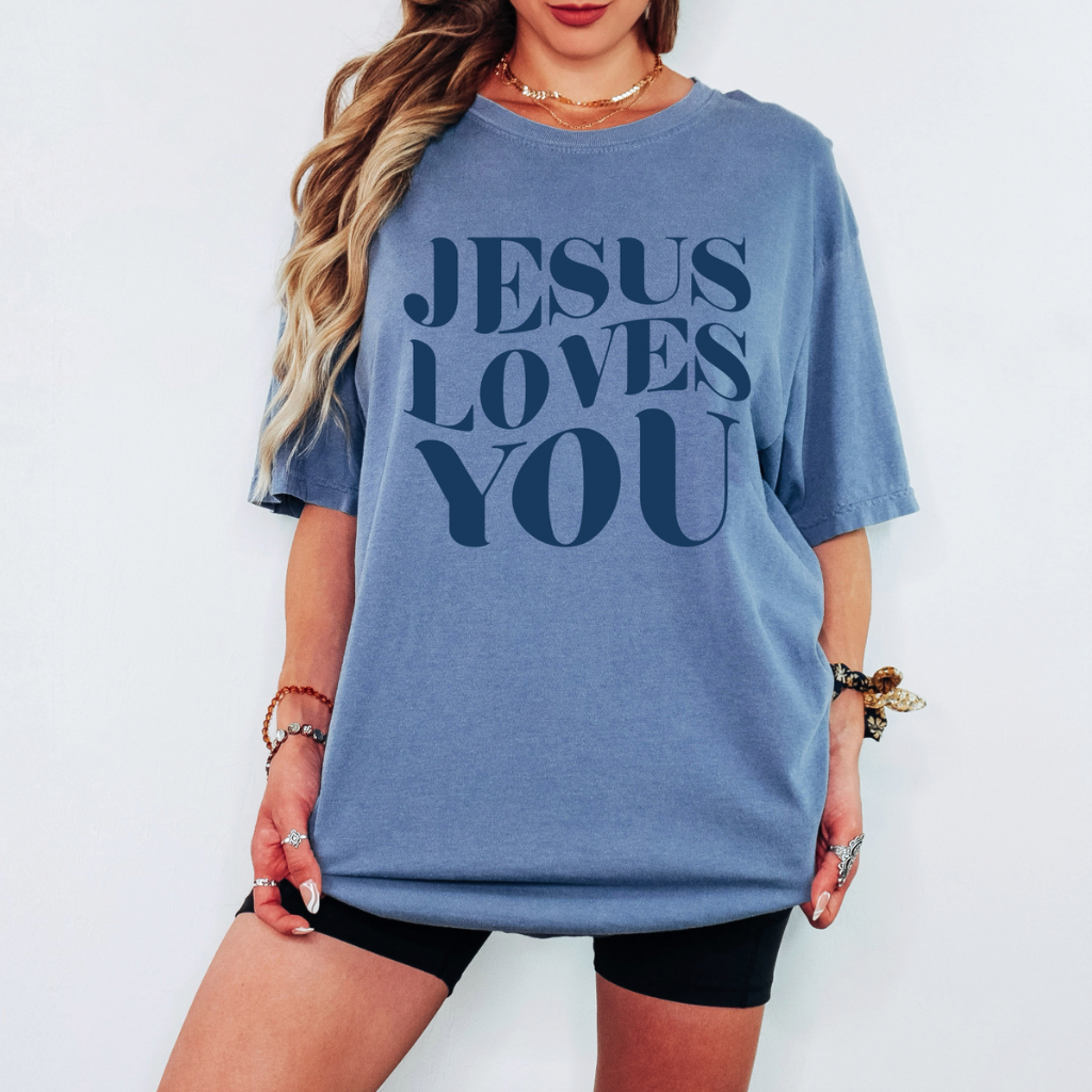Faith-based graphic t-shirt with large Jesus Loves You typography