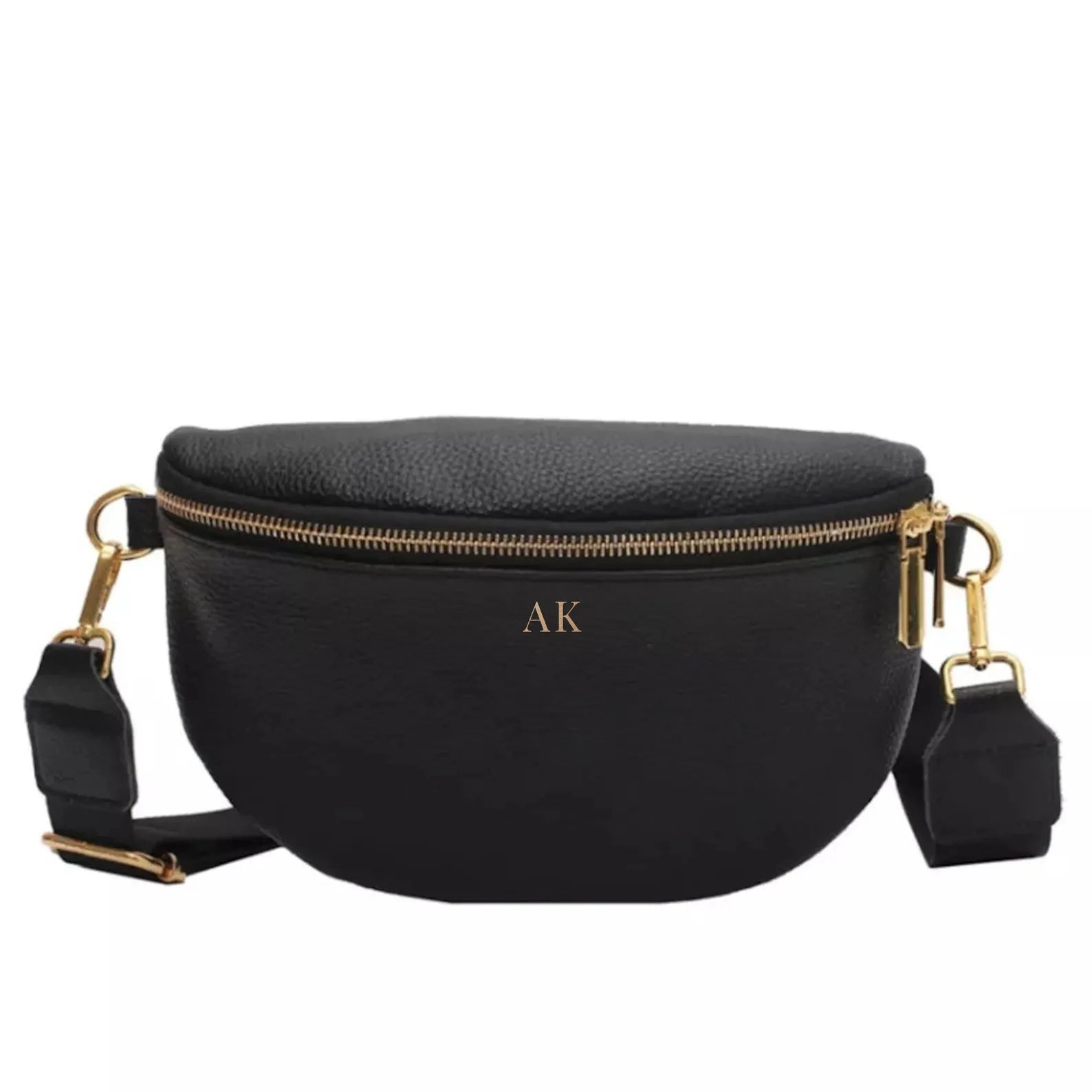 A women's black leather fanny pack crossbody bag, crafted from high-quality pebble leather. This versatile, water-resistant, and lightweight bag can be worn as a crossbody or belt bag and features an adjustable strap. Its compact yet spacious design measures 9.4”x5.9”x3.5”, ideal for daily use or travel. The bag is customizable with optional personalization, adding initials for a unique touch.