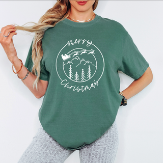 Person wearing a green t-shirt with a Christmas design on a white background