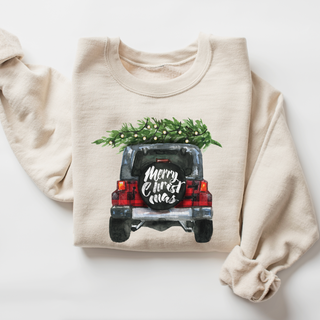 Beige sweatshirt with Christmas design of a car with a tree on top and 'Merry Christmas' text.