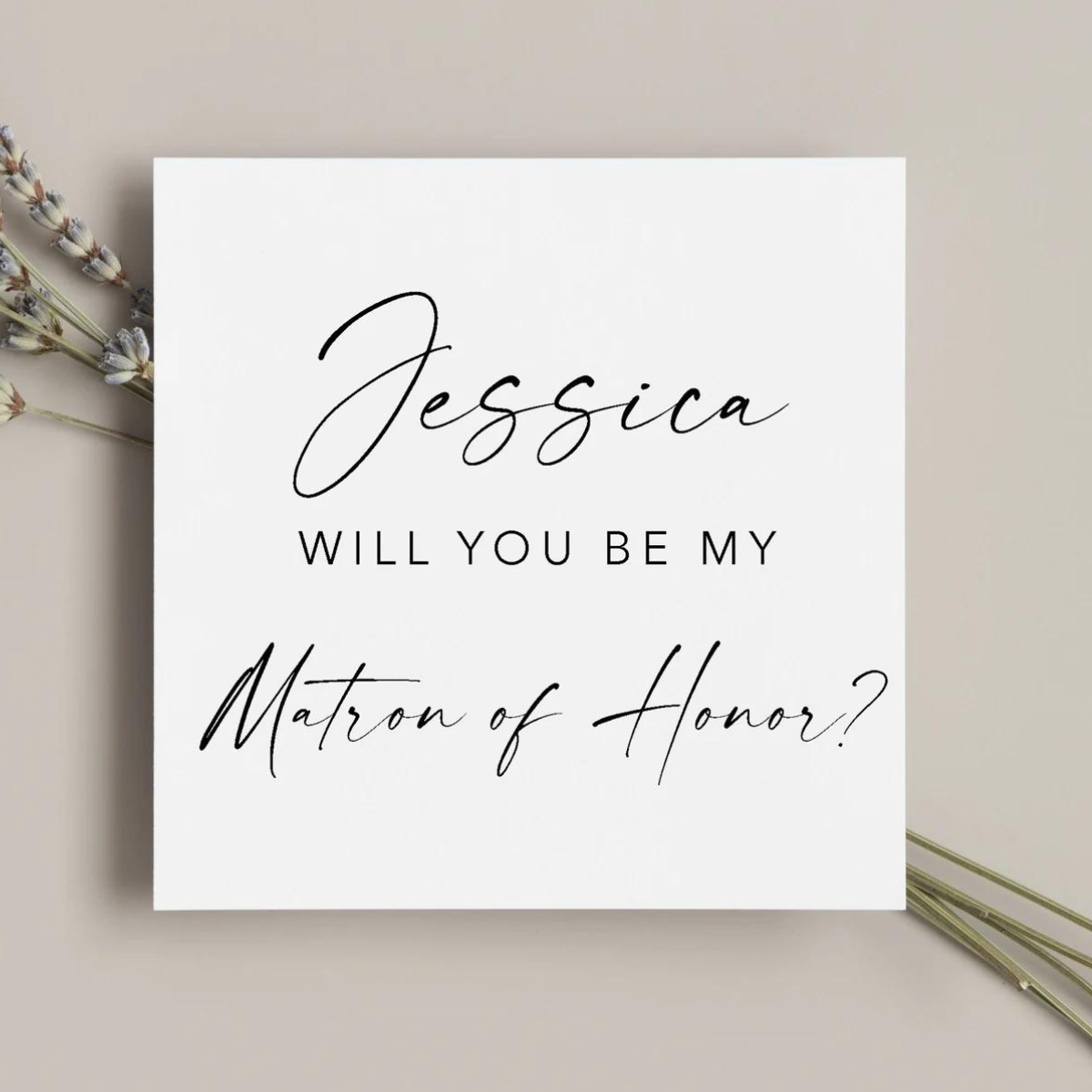 "Will You Be My Bridesmaid?" proposal card featuring classic black font. 