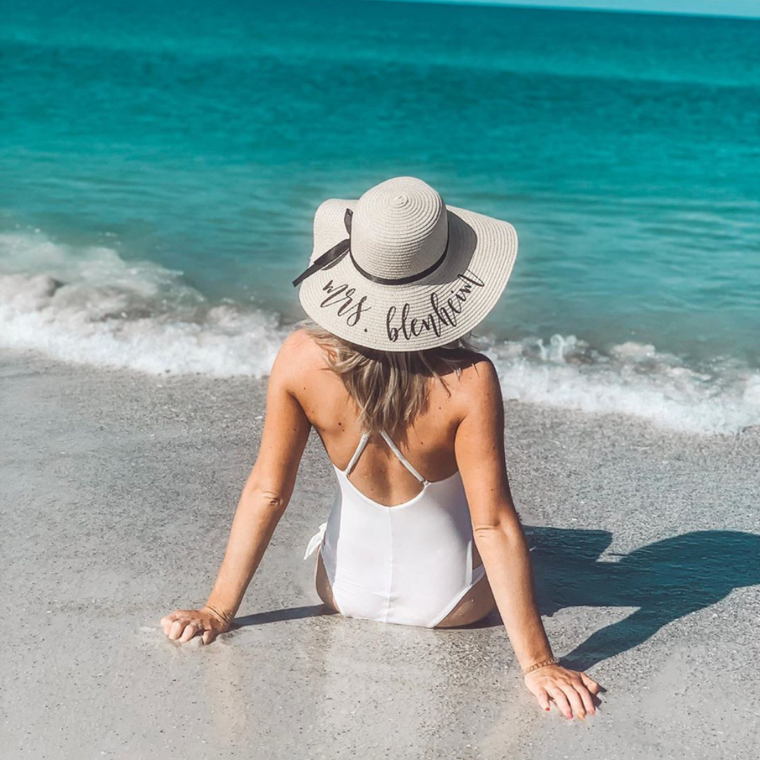 lady wearing Personalized Mrs. Beach Hat at the beach