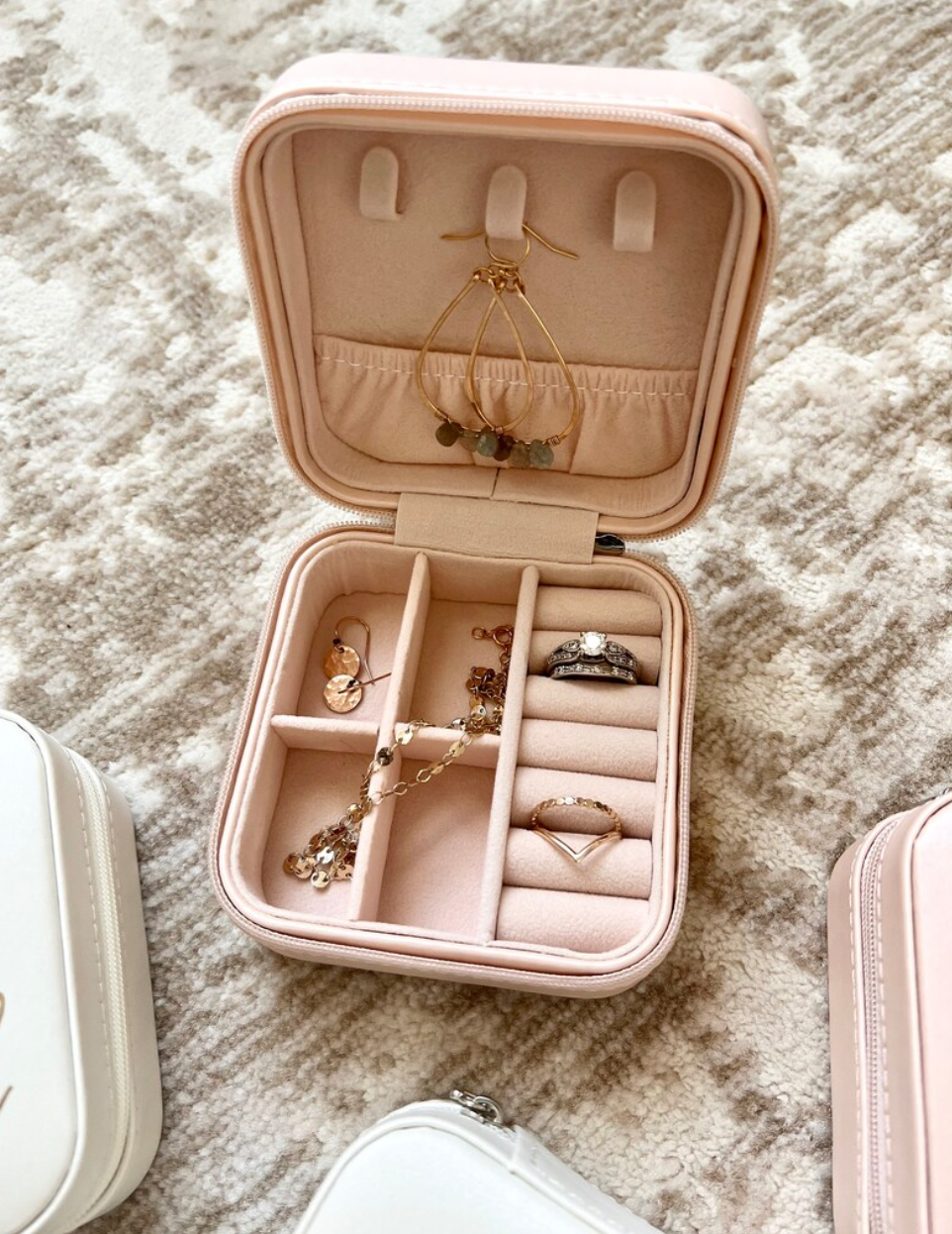 A personalized jewelry box designed for bridesmaids, available in three colors with options for three font colors. This travel-friendly box is stylish and practical, with compartments to hold jewelry securely. It makes an ideal gift for bridesmaids, perfect for storing jewelry while on the go, and can be personalized with names or monograms.