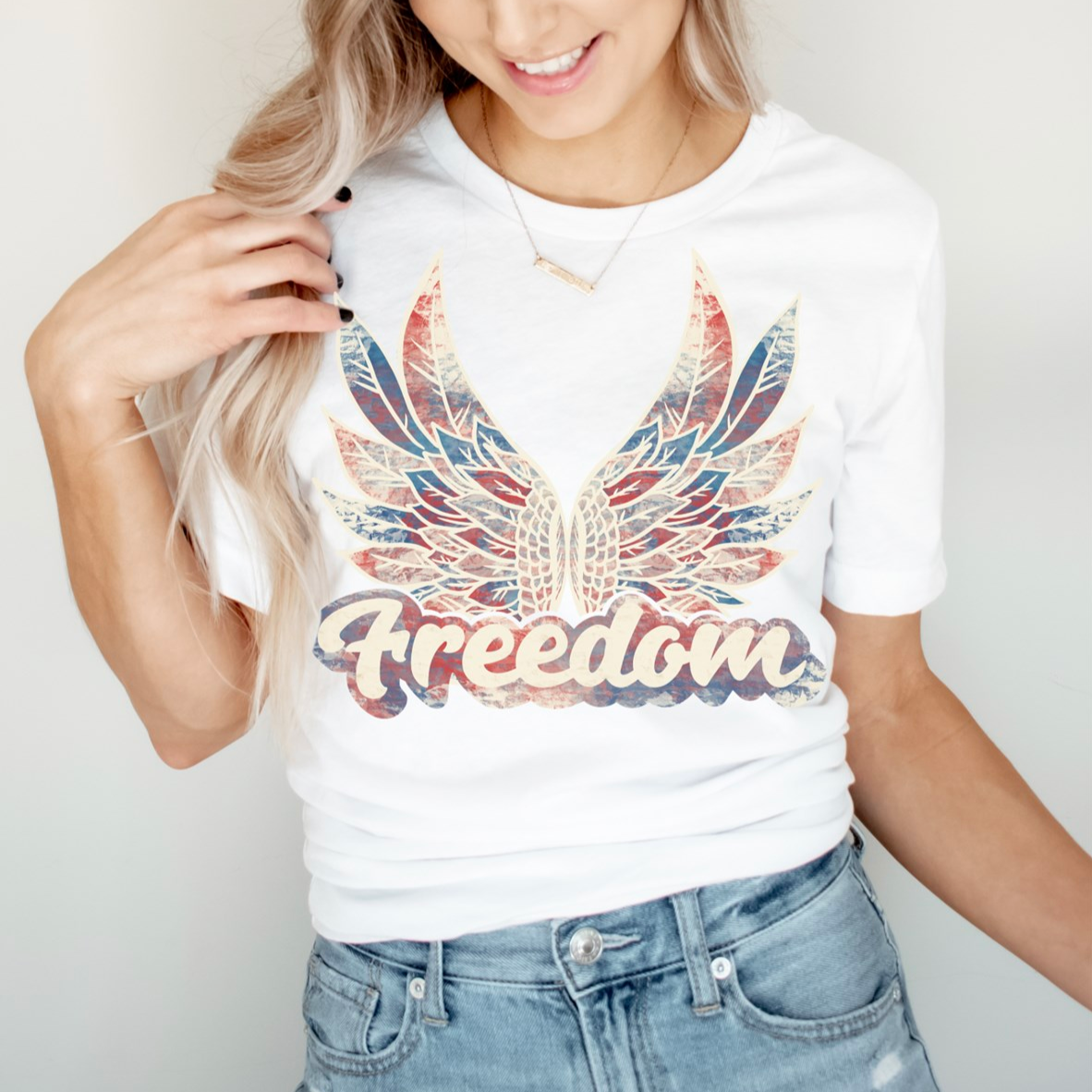 Freedom 4th of July Women's Graphic Tee, patriotic t-shirt with a bold 'Freedom' design, perfect for celebrating Independence Day, made from soft, breathable cotton for all-day comfort, available at Melody Faye.